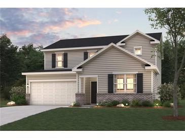 Charming two-story home featuring a covered porch, attached two-car garage, gray siding and manicured front lawn at 4155 Viola Pl, Atlanta, GA 30349