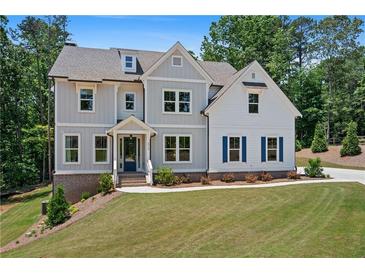 Charming two-story home with mixed siding, bright windows, and a well-manicured lawn at 3790 Chattahoochee (Lot 33) Rd, Cumming, GA 30041