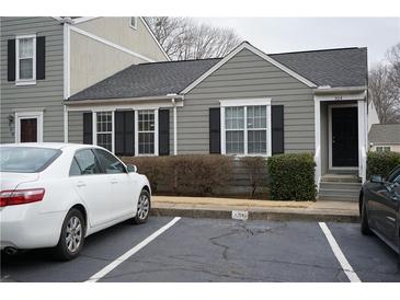 Charming single-story home with gray siding, black shutters, and well-maintained landscaping at 504 Harbor Lake Ct, Marietta, GA 30066