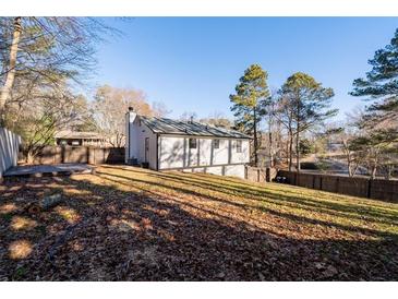 Expansive backyard with a deck, offering ample space for outdoor activities and relaxation at 2571 Hamill Dr, Buford, GA 30519