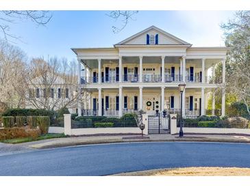 Elegant two-story home boasts striking architectural details, manicured landscaping, and a welcoming entrance at 3980 Saint Elisabeth Sq, Duluth, GA 30096