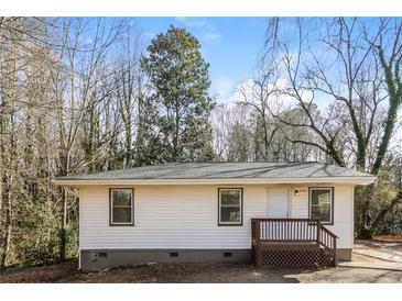 Charming single-story home featuring a cozy front porch and neutral siding at 114 Howell Sw Dr, Atlanta, GA 30331