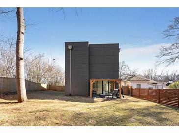 Modern home featuring a stylish patio, spacious backyard and modern exterior at 244 Locust Ne St # B, Atlanta, GA 30317