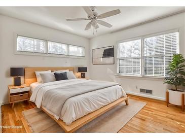 Bright bedroom with hardwood floors, modern decor, and a comfortable platform bed at 425 Lindbergh Ne Dr # A2, Atlanta, GA 30305