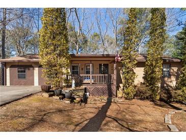 Charming single story home featuring a welcoming front porch and well maintained front yard at 28 East Boxwood Dr, Cartersville, GA 30121