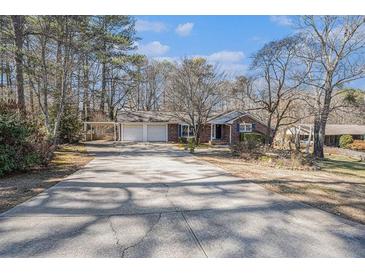 Charming single story home with mature trees and a long driveway at 2769 Carrie Nw Dr, Kennesaw, GA 30144