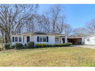 Charming single-story home with a landscaped front yard, offering cozy curb appeal at 8523 Duncan St, Douglasville, GA 30134