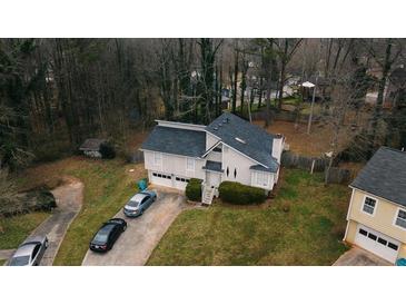 Inviting two-story home with a two-car garage and driveway parking at 3981 Rocmar Dr, Snellville, GA 30039