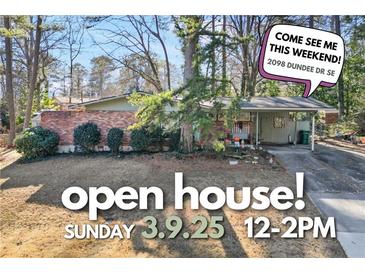 Charming single-story home featuring a brick facade and an open house invitation at 2098 Dundee Se Dr, Smyrna, GA 30080