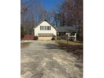 Traditional home with a two-car garage and driveway at 1531 Glendale Dr, Lawrenceville, GA 30043