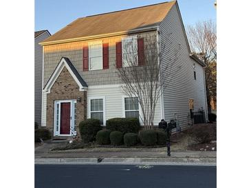 Charming two-story home featuring neutral siding, brick accents, and well-maintained landscaping at 3134 Imperial Sw Cir, Atlanta, GA 30311