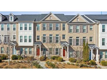 Charming townhome with brick facade, neutral shutters, and well-maintained landscaping at 146 Rowan Ave, Alpharetta, GA 30009