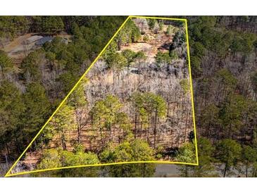 A beautiful lot surrounded by lush trees, ready to be built with your dream house at 150 Hillred Dr, Fayetteville, GA 30215