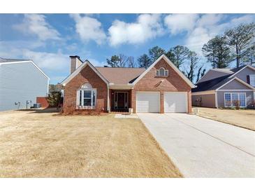 Charming brick home with a well-manicured lawn and two-car garage at 2701 Garland Way Way, Duluth, GA 30096