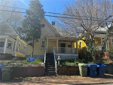 Charming two-story home featuring a cozy front porch and a traditional design, needs renovation at 193 Berean Se Ave, Atlanta, GA 30316