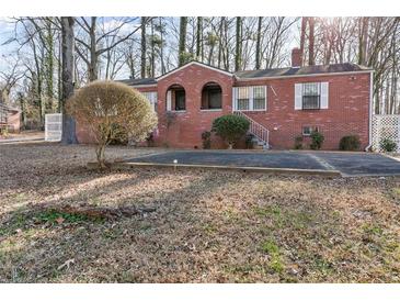 Charming brick home featuring a well-maintained front yard and arched entryway at 162 Fairburn Sw Rd, Atlanta, GA 30331