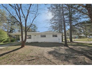 Charming single-story home with a carport and a well-maintained front yard at 10152 Griffin Sw Ln, Covington, GA 30014