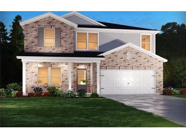 Charming two-story brick home with an attached two-car garage and a well-manicured lawn at 363 Denali Butte Ter, Canton, GA 30114