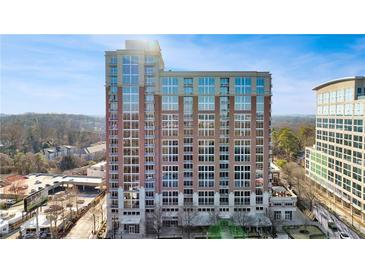 Modern high-rise building with brick facade and numerous windows providing stunning city views at 1820 Peachtree Nw St # 1207, Atlanta, GA 30309