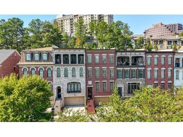 Charming brick townhomes feature beautiful architecture, balconies, and well-maintained landscaping at 3633 Broughton Se Cir, Atlanta, GA 30339