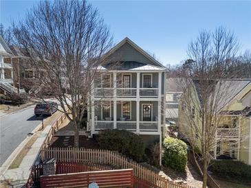 Charming two-story home with double front porches, offering a welcoming curb appeal and outdoor living space at 1637 Duncan Nw Dr, Atlanta, GA 30318