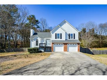 Charming two-story home with a two-car garage and well-maintained front yard at 2971 Ruby Ct, Powder Springs, GA 30127