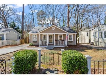 Charming bungalow with a cozy front porch and well-maintained yard at 144 Murray Hill Ne Ave, Atlanta, GA 30317