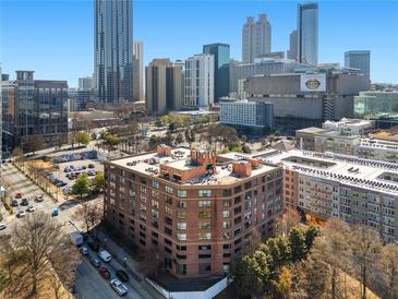 Brick apartment building in a bustling urban environment, near parking and lots of downtown businesses and destinations at 115 W Peachtree Nw Pl # 602, Atlanta, GA 30313
