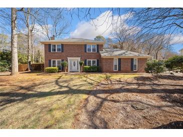 Charming two-story brick home with manicured landscaping and a classic design at 4358 Stockton Way, Marietta, GA 30066