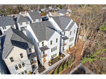 An aerial view of new modern townhomes with neutral colors, black framed windows, and professionally landscaped yards at 488 Hammons Way, Atlanta, GA 30315