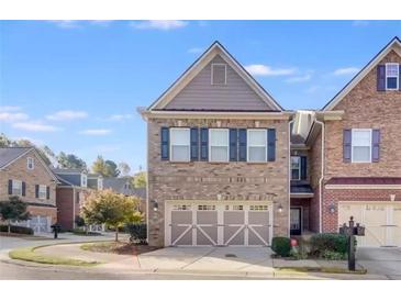 Charming two-story home featuring a brick facade, two-car garage, and inviting curb appeal at 3277 Bluejay Lane # 41, Alpharetta, GA 30022