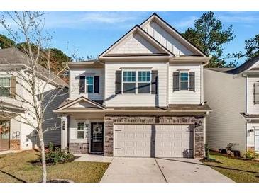 Charming two-story home with a welcoming front porch and a two-car garage with driveway at 158 Bryon Ln Ln, Acworth, GA 30102