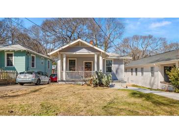 Charming craftsman home with a welcoming front porch and mature landscaping at 1446 Metropolitan Se Ave, Atlanta, GA 30316