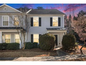 Charming two-story townhome with gray siding and black shutters, complemented by manicured landscaping and a well-maintained lawn at 3525 Parc Sw Cir, Atlanta, GA 30311