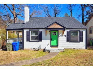 Charming home with a new gray roof, a green front door, and black trim at 232 Mathewson Sw Pl, Atlanta, GA 30314