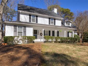 Charming two-story home with a welcoming front porch and well-maintained landscaping at 1938 Kelvin Dr, Lawrenceville, GA 30043
