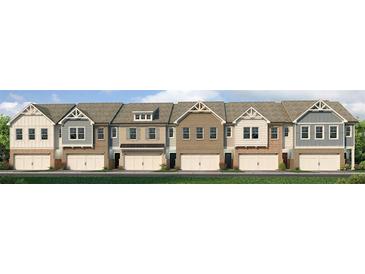 Charming townhome exteriors featuring varied siding, brick accents, and attached two-car garages at 328 Sinclair Ct # 78, Mcdonough, GA 30253