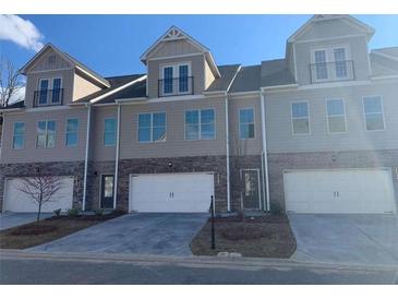 Charming townhome with neutral colors and a two-car garage at 2130 Manor Pointe Dr, Cumming, GA 30041