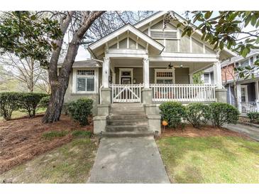 Charming home featuring a welcoming front porch, well-manicured landscaping, and inviting curb appeal at 592 Moreland Ne Ave, Atlanta, GA 30307