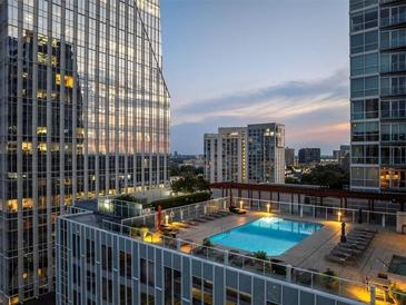 Rooftop swimming pool with city views, lounge chairs and an adjacent deck for relaxing and entertaining at 3325 Piedmont Ne Rd # 1504, Atlanta, GA 30305