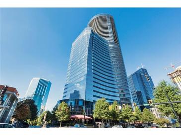 Stunning view of the glass building on a sunny day against the clear blue sky at 3344 Peachtree Ne Rd # 3305, Atlanta, GA 30326