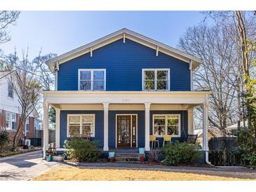 Charming two-story blue home with a covered front porch and classic architectural details at 1101 United Se Ave, Atlanta, GA 30316