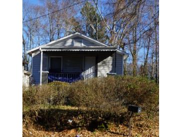 Charming home featuring a covered porch area and some landscaping at 571 Grant Sw St, Atlanta, GA 30315