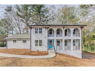 Charming two-story home with inviting blue door and upper-level balconies at 3186 Quail Ct, Decatur, GA 30034