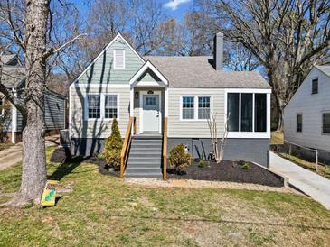 Charming renovated bungalow featuring gray siding, white trim, and a welcoming front porch at 1891 W Forrest Ave, Atlanta, GA 30344