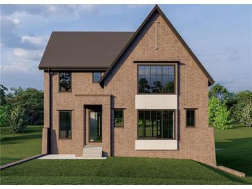 Charming two-story brick home featuring expansive windows and a stylish entrance at 1338 Wayne Ne Ave, Atlanta, GA 30306