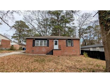 Charming single-story brick home featuring well-maintained landscaping at 2914 Wanda Sw Cir, Atlanta, GA 30315