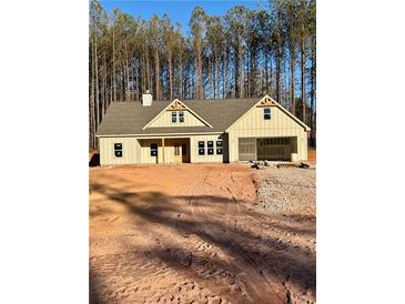 Charming single-story home featuring board and batten siding, an attached two car garage, and beautiful detailing at 16 Lexie Ct, Rockmart, GA 30153