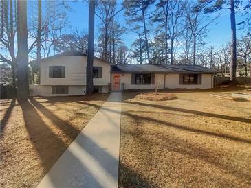 Charming single-story home with tidy landscaping and a welcoming front yard at 2217 Troutdale Dr, Decatur, GA 30032