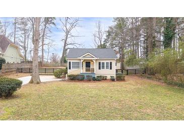 Charming home featuring a well-manicured lawn and classic architecture in a tranquil setting at 4101 Morgan Rd, Tucker, GA 30084